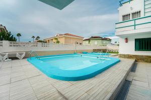 a swimming pool on top of a building at Blue Ski 6 by Homestaygrancanaria in San Bartolomé de Tirajana