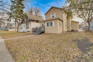 a house with a driveway in front of it at Updated Home Less Than 1 Mi to Downtown Fargo! in Fargo