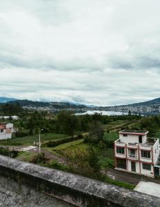 a view of a river and a building at Hotel IntyKucha in San Rafael