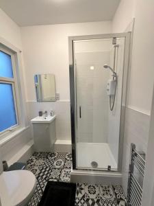 a bathroom with a shower and a toilet at Lovely Town house Room 2 in Parkside