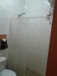 a bathroom with a shower and a toilet at Pousada Villa Concetta in Cidade Velha +54 photos