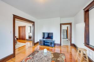 a living room with a tv and a table at Lovely Lancaster Studio in Walkable Location! in Lancaster