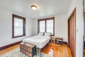 a bedroom with a bed and a table and windows at Lovely Lancaster Studio in Walkable Location! in Lancaster