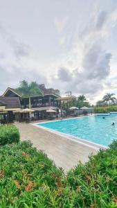 a large swimming pool next to a resort at 2 Br Condo Unit Cagayan de Oro City in Cagayan de Oro