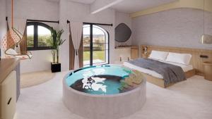 a bedroom with a tub in the middle of the room at Unsal Hotel in Oludeniz