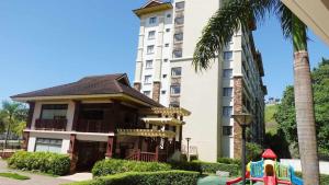 a building with a playground in front of a building at 2 Br Condo Unit Cagayan de Oro City in Cagayan de Oro