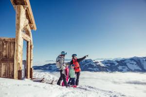 a group of people standing on top of a snow covered mountain at Hochmuthhof in Reith im Alpbachtal +78 photos