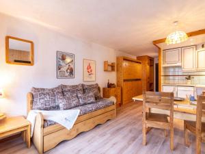 a living room with a couch and a table at Apartment Le Prariond-4 in Tignes