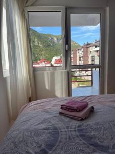 Ένα ή περισσότερα κρεβάτια σε δωμάτιο στο Cozy apartment with the view