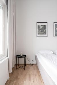 Posteľ alebo postele v izbe v ubytovaní 2ndhomes Tampere "Puistotie" Apartment - 2BR Apt with Sauna and Balcony at Tammela Stadium