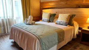 Cama ou camas em um quarto em Hotel El Coihue