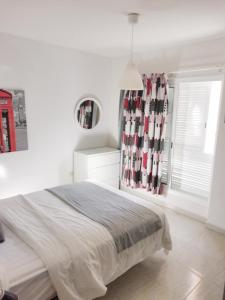 En eller flere senge i et værelse på Apartamento Triana + 10 billeder