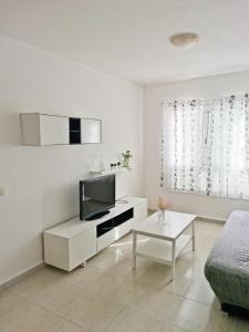 Et tv og/eller underholdning på Apartamento Triana