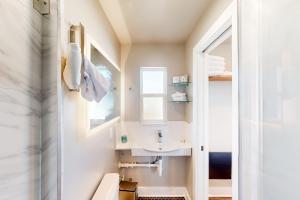 a bathroom with a sink and a mirror at Beach 5 Villas #B2 in Fernandina Beach