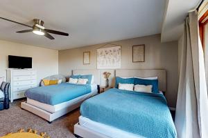 מיטה או מיטות בחדר ב-Lake Haven Condo