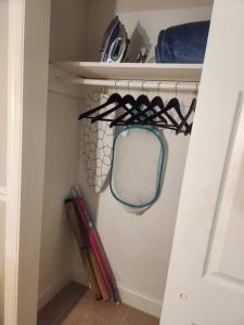 a closet with a mirror and some baseball bats at Charming Jax Apt for 4 with free parking in Jacksonville