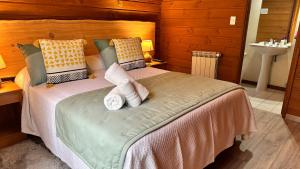 Cama ou camas em um quarto em Hotel El Coihue