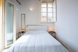 Ένα ή περισσότερα κρεβάτια σε δωμάτιο στο Castello Attic Sunset Terrace