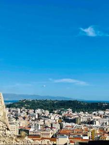a view of a city with buildings in the background at Castello Attic Sunset Terrace in Cagliari