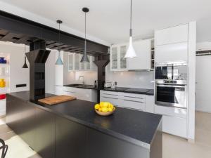 a kitchen with a bowl of fruit on a counter at Apartment Cosy by Interhome in Tossa de Mar