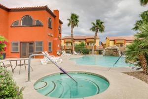a swimming pool in front of a building at Mesquite Condo with Pool and Spa Access, Near Casinos! in Mesquite