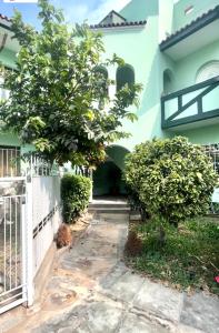 a courtyard of a house with trees and a fence at Colonial Style Apartment in San Isidro in Lima