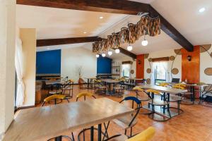 a restaurant with tables and chairs in a room at Casa 1800 Ataco Hotel Boutique in Concepción de Ataco
