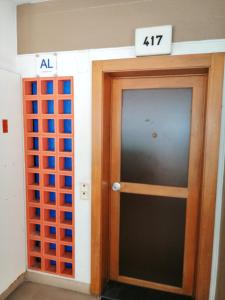 a door in a building with a sign above it at Charming apartment in São Pedro do Sul 30 m² with lake view in São Pedro do Sul +25 photos