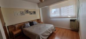 Postel nebo postele na pokoji v ubytování COSTANERA MAR DE AJO