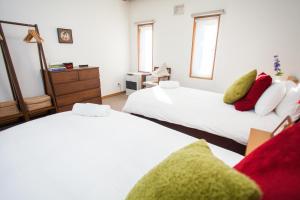 Postel nebo postele na pokoji v ubytování Yume House