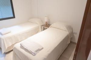 Postel nebo postele na pokoji v ubytování Torre Alem 4 A