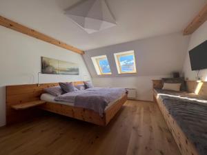 a bedroom with a large wooden bed in it at TurrachART in Turracher Hohe