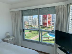 Μια τηλεόραση ή/και κέντρο ψυχαγωγίας στο Parada 4 Brava 1ra Linea playa - Todos los servicios - Edificio Estrella de Mar