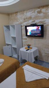 TV a/nebo společenská místnost v ubytování Pousada Casa Porto