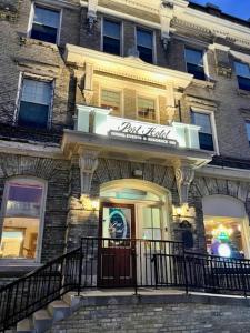 a building with a sign on the front of it at The Port Hotel in Port Washington