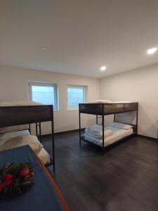 a room with two bunk beds in it at Dolomiti Brenta apartment da Gloria in Dercolo 
