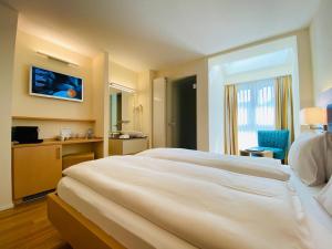 Tempat tidur dalam kamar di Hotel Felmis SELF CHECK-IN