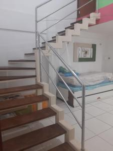 a staircase with a bunk bed in a room at Flat Amarração 130 in Luis Correia