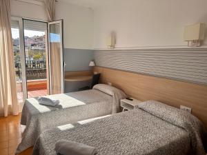 Postel nebo postele na pokoji v ubytování Can Setmanes by CozyCatalonia