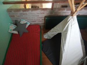 Ένα ή περισσότερα κρεβάτια σε δωμάτιο στο Casita Ukuchay Pcia Bs As +14 φωτογραφίες