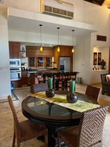 a dining room and kitchen with a table and chairs at Luxury private village Cap Cana in Punta Cana