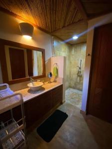 a bathroom with a sink and a shower at Luxury private village Cap Cana in Punta Cana