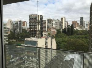 a view of a city skyline from a window at Studio Libertador Premium! Location ! in Buenos Aires