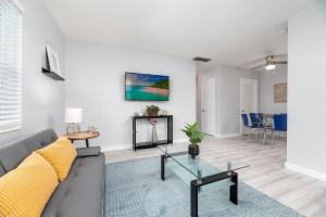 a living room with a couch and a table at Short Walk to Wilton Drive Apt1 in Fort Lauderdale