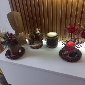 a white table with some plants and vases on it at Apartman Prodan in Sombor