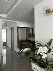 a living room with a mirror on the wall at Harhoura Modern Flat in Temara