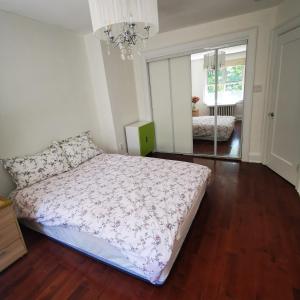 a bedroom with a bed and a chandelier at toronto midtown luxury double bed in Toronto