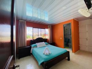 Postel nebo postele na pokoji v ubytování Hotel Caribe La Vega