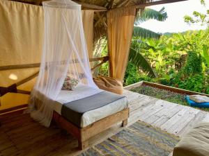 Ένα ή περισσότερα κρεβάτια σε δωμάτιο στο Samana Ecolodge +121 φωτογραφίες