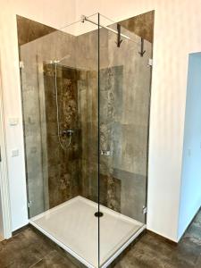 a shower with a glass door in a bathroom at H-36 RESIDENCE 0.1 in Koblenz